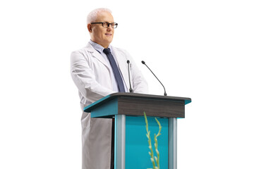 Canvas Print - Mature male doctor giving a speech from a tribune