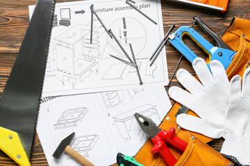 Wall Mural - Furniture assembling plan and set of tools on wooden background, closeup