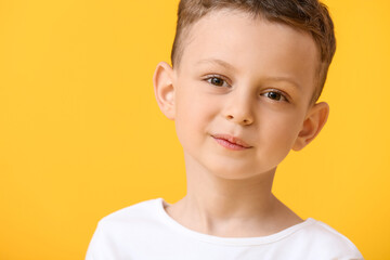 Poster - Portrait of happy little boy on color background