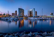 Beautiful twilight mood at the San Diego Marina, with yachts and the Marriott Marquis hotel reflected in the water