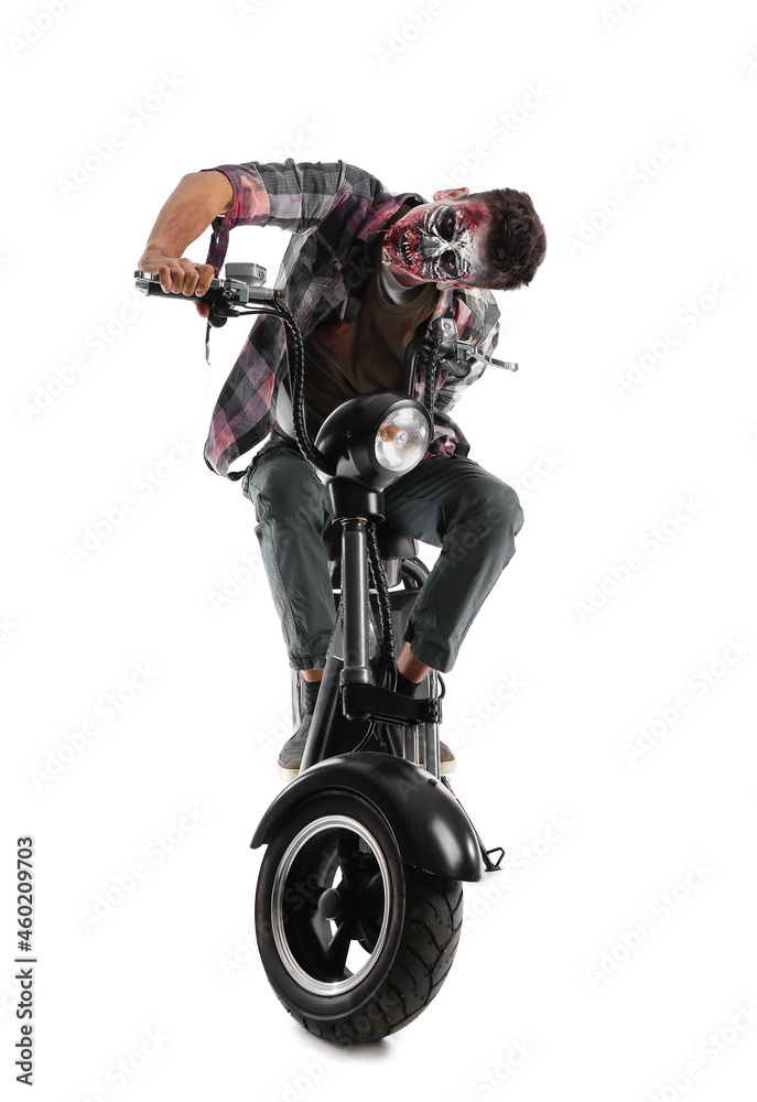 Man dressed for Halloween as zombie with motorcycle on white background