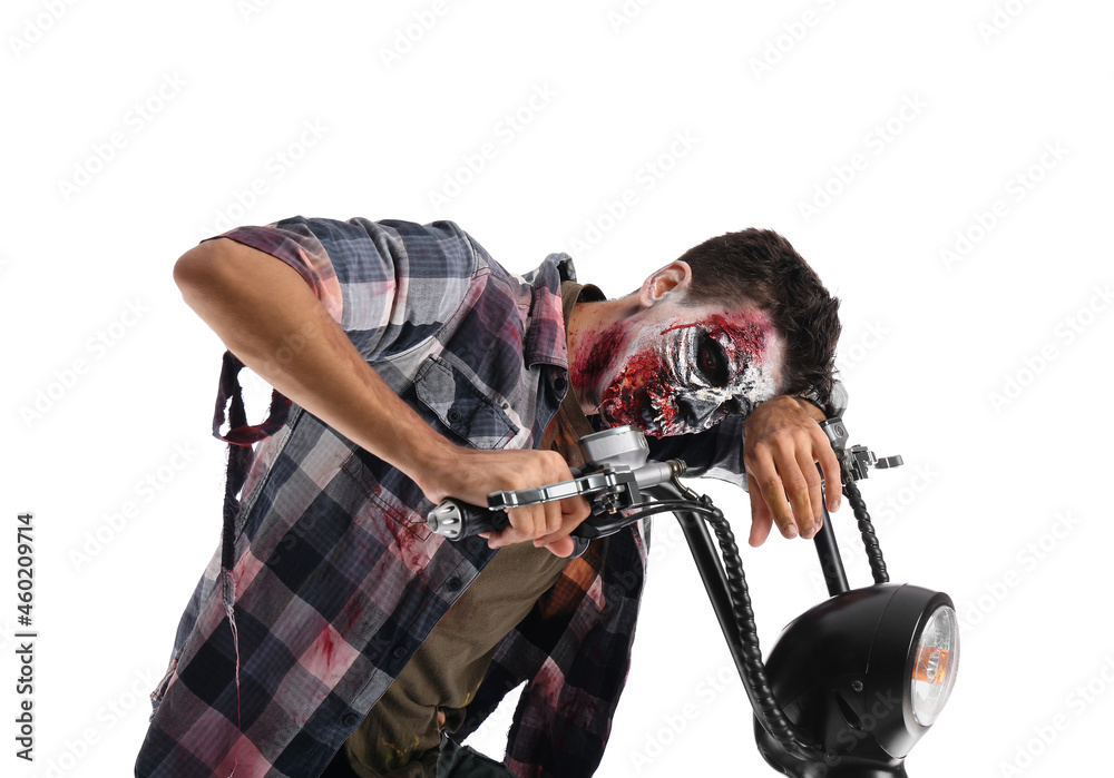 Man dressed for Halloween as zombie with motorcycle on white background
