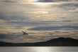 A small white seaplane takes off from Lake Storsjön in Östersund