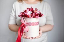 Dried Flower Bouquet With Grasses In Pink Hat Box In Hands