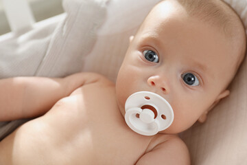 Canvas Print - Cute little baby with pacifier lying in crib