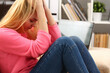 © H_Ko - Unhappy lonely depressed woman sitting on the couch