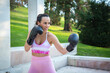 © luisrojasstock - smiling young athlete woman training boxing with gloves giving a crochet