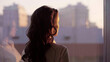 © nimito - Young beautiful businesswoman admire cityscape at sunset in modern office with large window