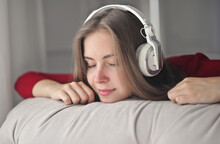 Portrait Of A Young Woman Listening To Music