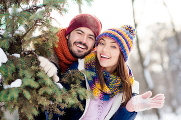 Wall Mural - Photo of young attractive couple happy positive smile forest woods together husband wife love story winter