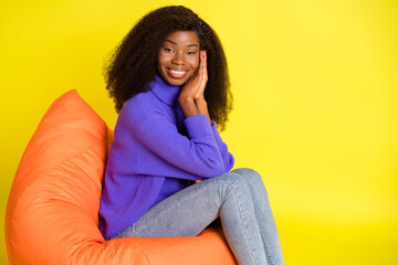 Poster - Profile portrait of attractive dark skin person hands palms together on cheek isolated on yellow color background