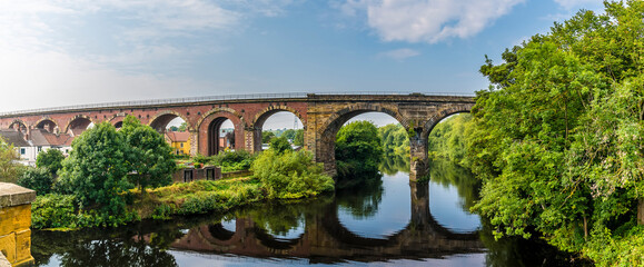 Wall Mural - A panorama view from the road bridge towards the railway viaduct at Yarm, Yorkshire, UK in summertime