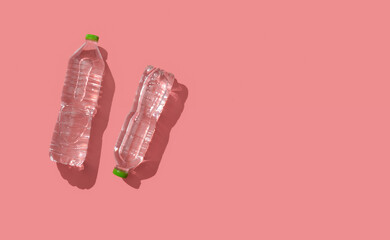 Sticker - Plastic bottles with pure water on pink background,Top view,Copy space