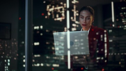 Poster - Successful Businesswoman in Stylish Suit Working, on Laptop Looking in Wonder at Night City. Stylish Beautiful Female CEO Working Late on Computer to Achieve Best Results. Colorful Cinematic Portrait