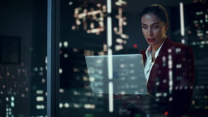 Poster - Successful Businesswoman in Stylish Suit Working, on Laptop Looking in Wonder at Night City. Stylish Beautiful Female CEO Working Late on Computer to Achieve Best Results. Colorful Cinematic Portrait