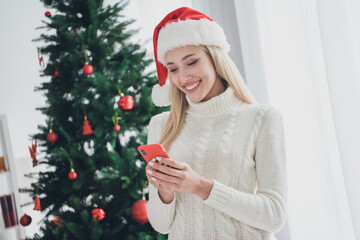 Sticker - Photo portrait woman wearing white knitted sweater cap browsing internet with smartphone