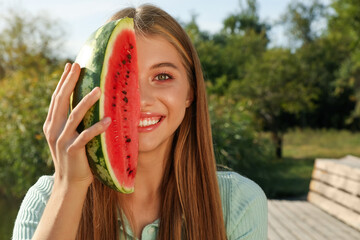 Canvas Print - Beautiful girl with slice of watermelon outdoors