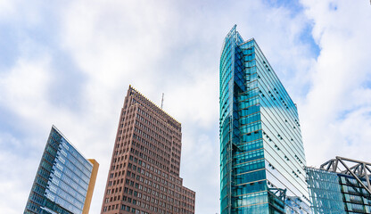 Sticker - Futuristic high-rise commercial office buildings rise behind train station building on Potsdamer Platz