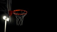 Basketball Players Near The Opponent's Basket. Basketball Court. Decisive Moment. Basketball Basket With Iron Net In Floodlight. Team Play. 