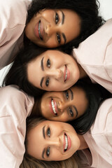 Wall Mural - group of different ethnicity women. multicultural diversity and friendship.