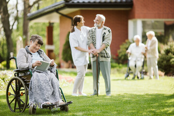 Poster - Sunny afternoon in the garden of nursing home for elderly