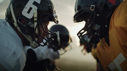 Wall Mural - American Football Game Start Teams Ready: Close-up Portrait of Two Professional Players, Aggressive Face-off. Competitive Warriors Full of Brutal Energy, Power, Skill. Dramatic Stare. Cinematic Shot