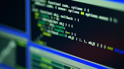 Close up of monitor screen with developing programming and coding technologies. Programmer or hacker is typing code on keyboard. Concept of bitcoin btc mining and development in virtual cyber space