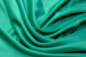 Wall Mural - Texture, background, pattern. Texture of green silk or cotton or wool fabric. Beautiful pattern of fabric.