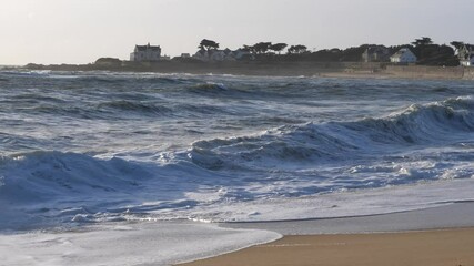 Wall Mural - Some waves on the french shore at Valentin beach. A sand beach located at Batz-sur-mer on the Atlantic side.