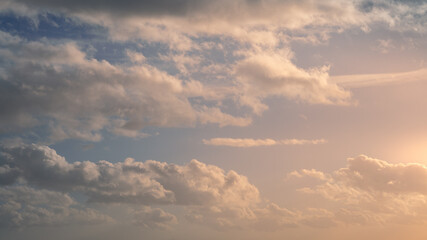 Wall Mural - Wonderful view of cumulus clouds sky with orange sun light at sunset of summer