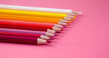 Fototapeta Tęcza - Colored pencils on a pink background