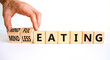 Mindful or mindless eating symbol. Doctor turns cubes and changes words mindless eating to mindful eating. Beautiful white background, copy space. Medical and mindful or mindless eating concept.