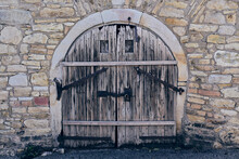 Old Wooden Cellar Door In An Old Stone Wall