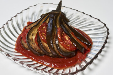 Poster - Delicious dish made of eggplant with tomatoes and sauce on a plate