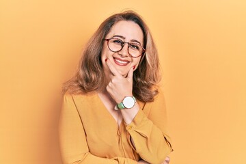 Poster - Middle age caucasian woman wearing casual clothes and glasses looking confident at the camera smiling with crossed arms and hand raised on chin. thinking positive.