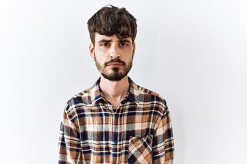 Poster - Hispanic man with beard standing over isolated background depressed and worry for distress, crying angry and afraid. sad expression.