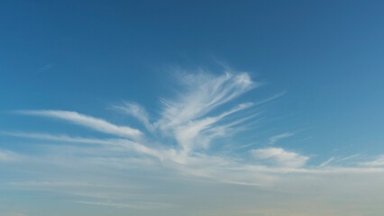 Wall Mural - wispy clouds and blue sky suitable for background