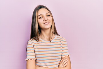 Sticker - Young brunette girl wearing casual striped t shirt happy face smiling with crossed arms looking at the camera. positive person.