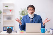 © Elnur - Young male employee after accident sitting at workplace