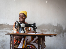 African Female Tailor Working On Sewing Machine