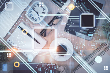 Double exposure of technology theme drawing over work table desktop. Top view. Global data analysis concept.