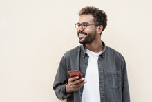 Young Handsome Man Using Smartphone In A City. Smiling Student Men Texting On His Mobile Phone Isolated Portrait. Modern Lifestyle, Connection, Business Concept
