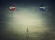 © psychoshadow - Lost man in the middle of nowhere with signposts showing two opposite directions to choose between left and right. Arrows aimed at different courses. Road way decisive choice. Dilemma concept