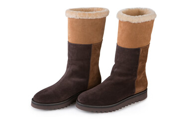 Wall Mural - a pair of brown suede women's boots with a fur trim, on a white background