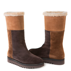 Wall Mural - high suede women's boots with a fur trim, on a white background