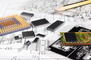 Electronic board, pen, processor and radio components on background of  schematic circuit diagram and a photomask for manufacture of printed circuit boards. Concept for design of electronic devices.