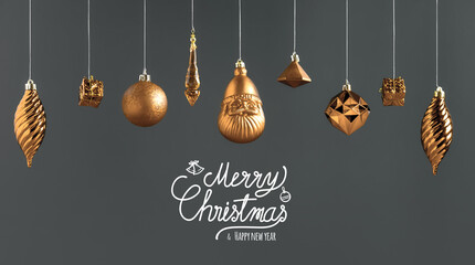 Poster - Merry Christmas and happy new year text with golden bauble decoration hanging on dark modern grey background.winter holiday greeting card