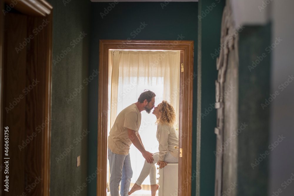 Loving couple kissing each other at home. Profile of affectionate ...