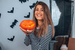 © Kitja - Happy Halloween! Woman enjoying party. Holiday concept.