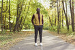 © satura_ - African american student walking in the park in autumn season